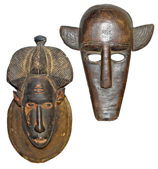 A Baule mask from the Ivory Coast and a Bamana hyena mask from Mali. Mosby & Co. image